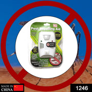 A single white pest repelling aid in its clear plastic and green cardboard packaging, against a blurry background.