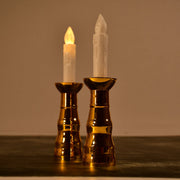 A pair of decorative flameless LED candle lights creating a warm ambiance.