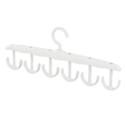 Side view of the space-saving tank top hanger with garments, showcasing its slim profile.
