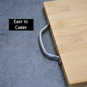 Thick cutting board made of bamboo, perfect for chopping vegetables.