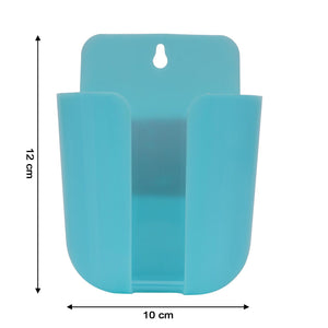 Colorful wall-mounted organizer for remotes and small household items.