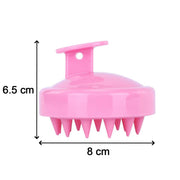Scalp massager shampoo brush in a bathroom setting, ready for use.