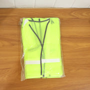 Individual wearing the reflective safety jacket during an outdoor activity for visibility.